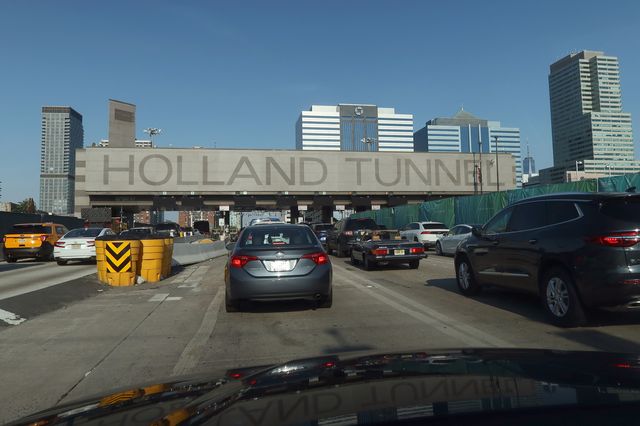 Vehicles drive into the Holland Tunnel on their way to New York City in June 2021. A proposed project would widen the New Jersey Turnpike extension leading to the tunnel.